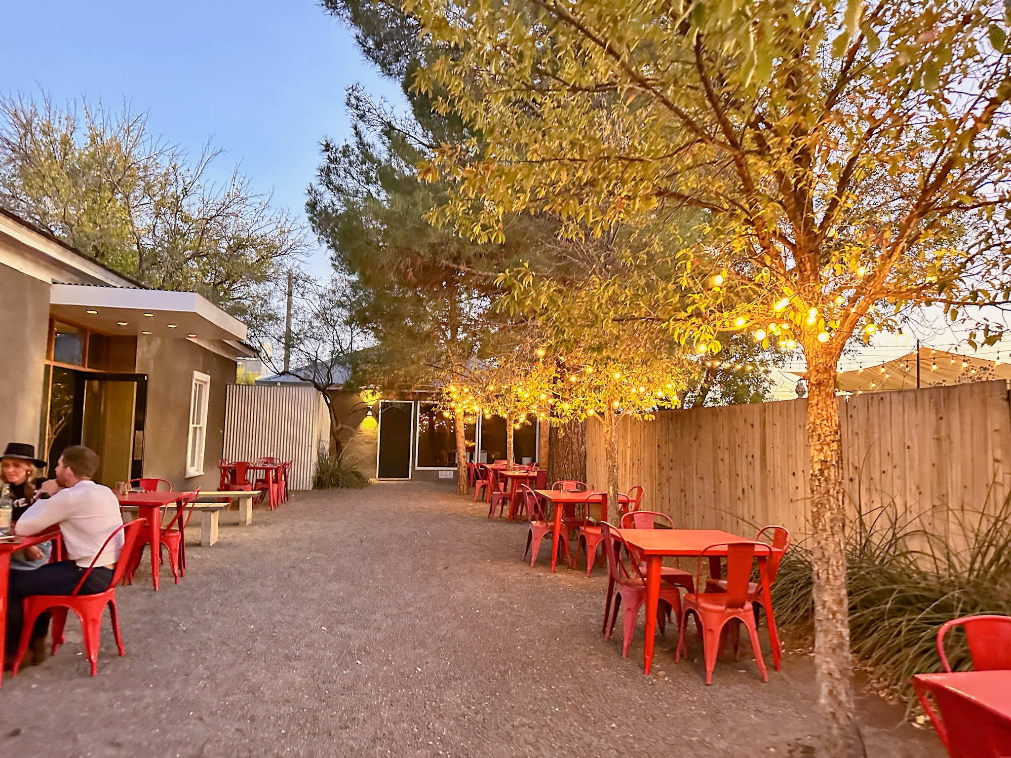 An image of the patio after sunset at Cochineal